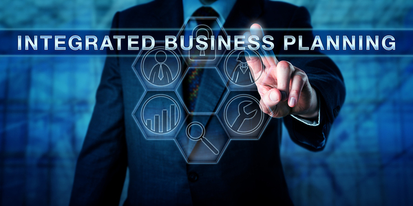 Man in business suit pointing to the words integrated business planning.