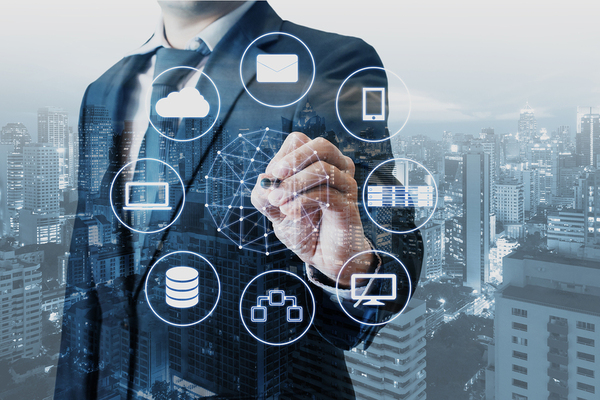 Man in a business suite pointing at a digitally created circle.