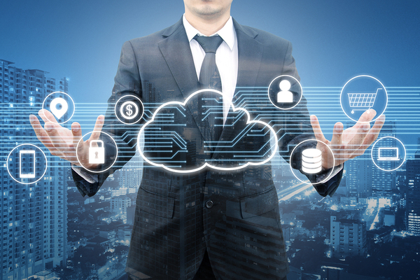 Man in a business suit holding his palms upward with a digitally drawn cloud.