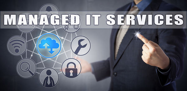 Man in a business suit with a digitally created graphic and the words managed it services.