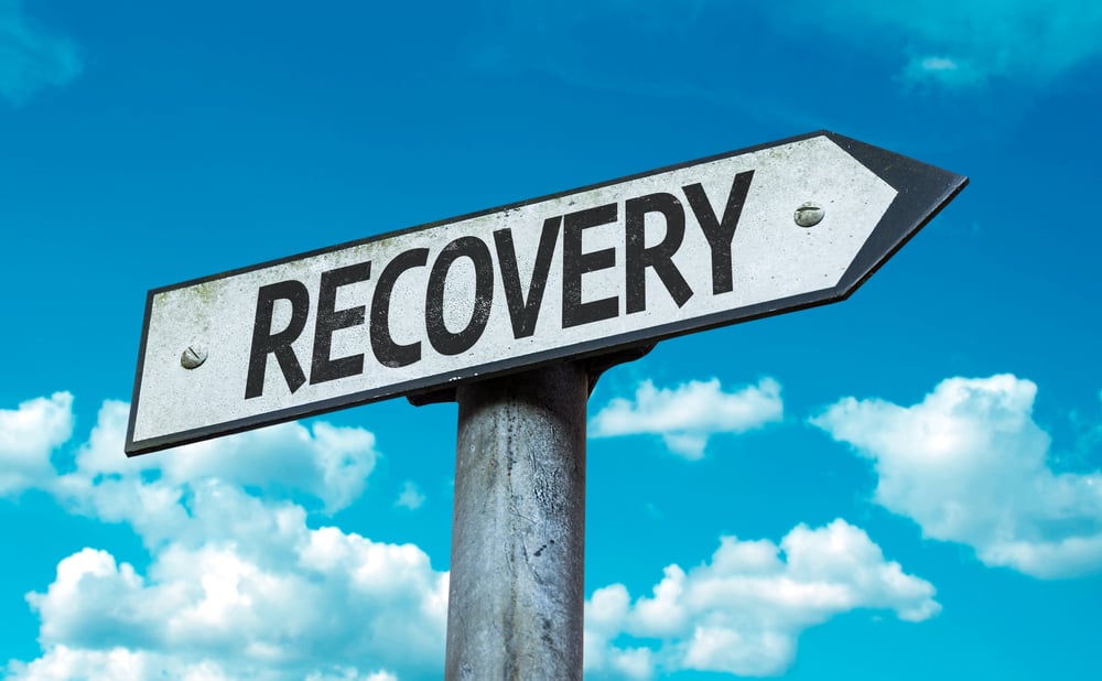 Recovery sign with sky background
